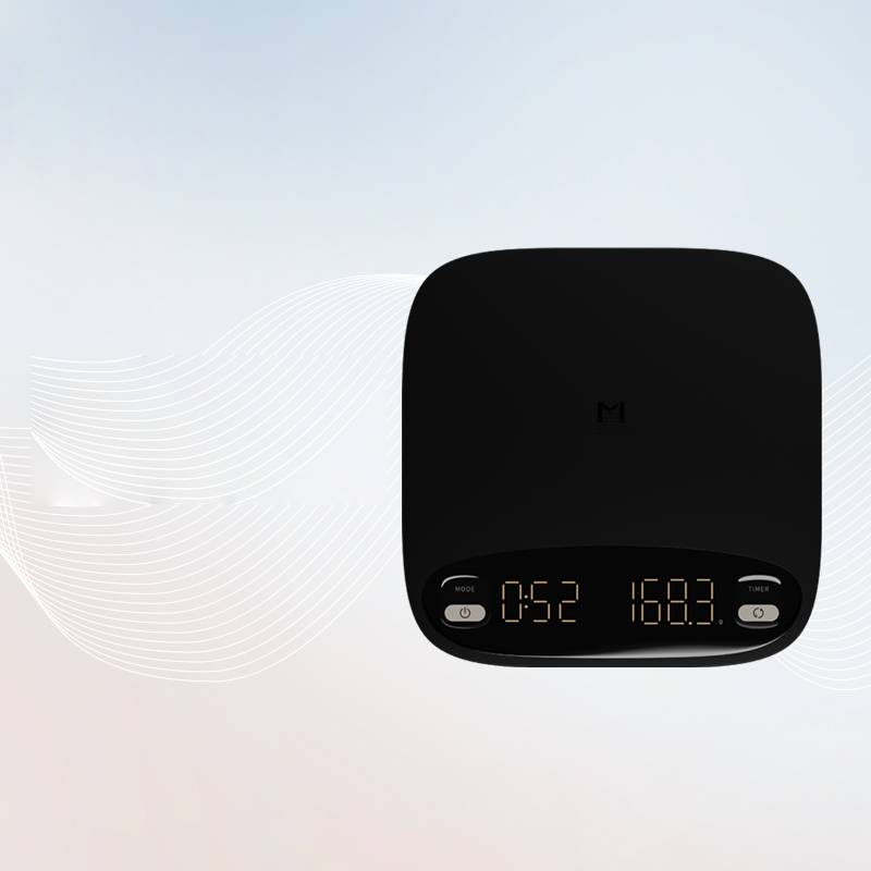 Coremet Ltd handcrafted precision coffee weighing scale for business kits, featuring a sleek digital display and stainless steel surface.