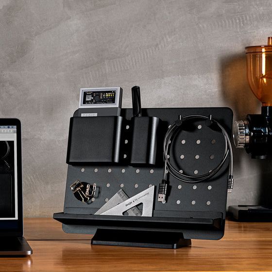 Coremet Ltd desktop storage rack and desk organiser for business kits, featuring compartments for organizing office supplies.