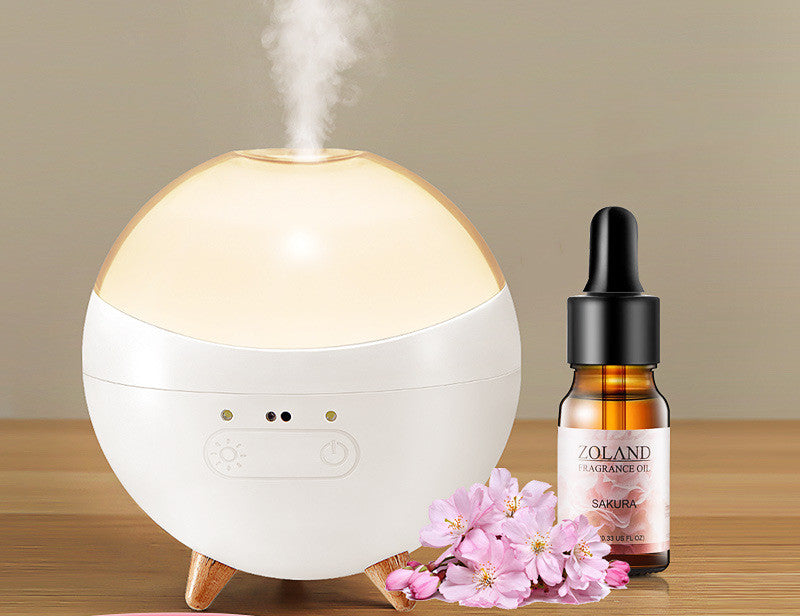 Coremet Ltd ultrasonic aroma diffuser and humidifier in a business kit, featuring a sleek design with mist and essential oil tray.