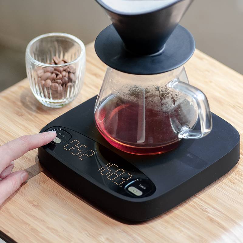 Coremet Ltd handcrafted precision coffee weighing scale for business, showing digital display and stainless steel surface.