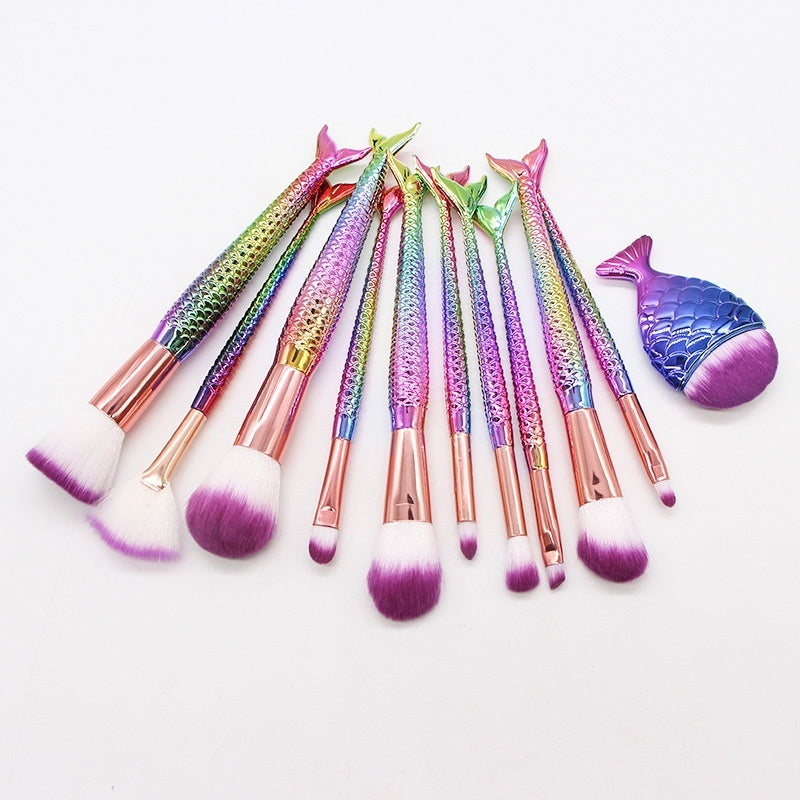 Set of 10 mermaid-themed makeup brushes in a business kit by Coremet Ltd, featuring colorful handles and soft bristle makeup tools.