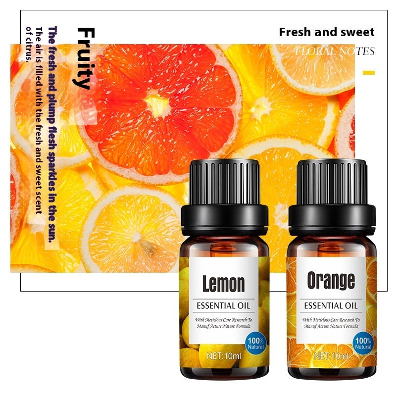 Aroma diffuser with a small bottle of lavender essential oil and fresh orange slices, part of Coremet Ltd's business kit.