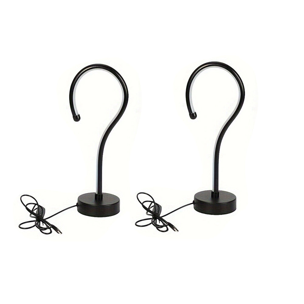 Coremet Ltd Dual Question Mark Dimmable Desk Lamp in black with adjustable arm and modern design on a workspace.