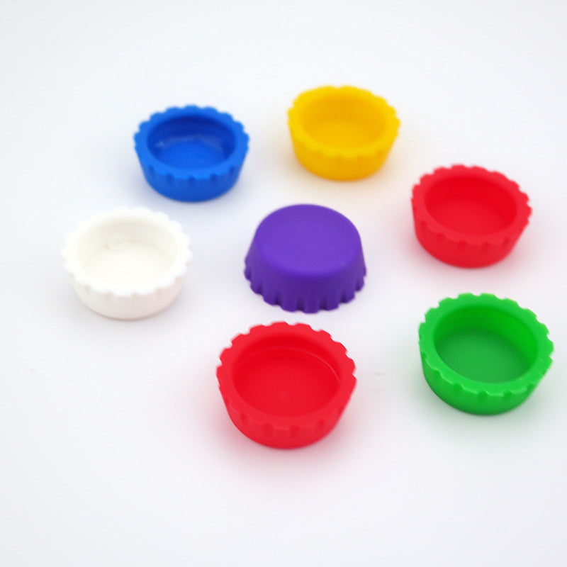 Food grade silicone bottle caps from Coremet Ltd business kits, flexible and reusable caps for sealing bottles effectively.