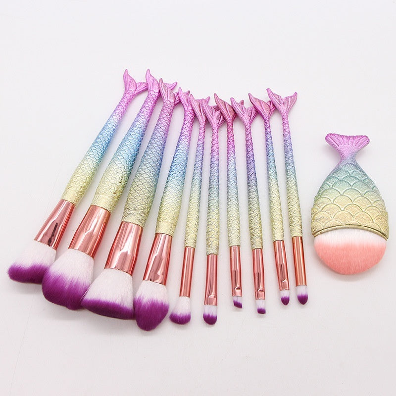 Set of 10 Mermaid-themed makeup brushes from Coremet Ltd, featuring colorful handles and soft bristles for beauty application.