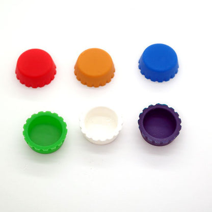 Food grade silicone bottle caps from Coremet Ltd Business Kits, showing colorful, flexible caps suitable for various bottles.