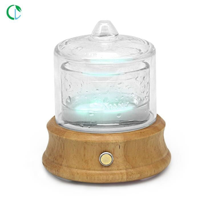 Glass water tank aroma diffuser from Coremet Ltd business kit, with a clear glass tank and diffuser components visible.