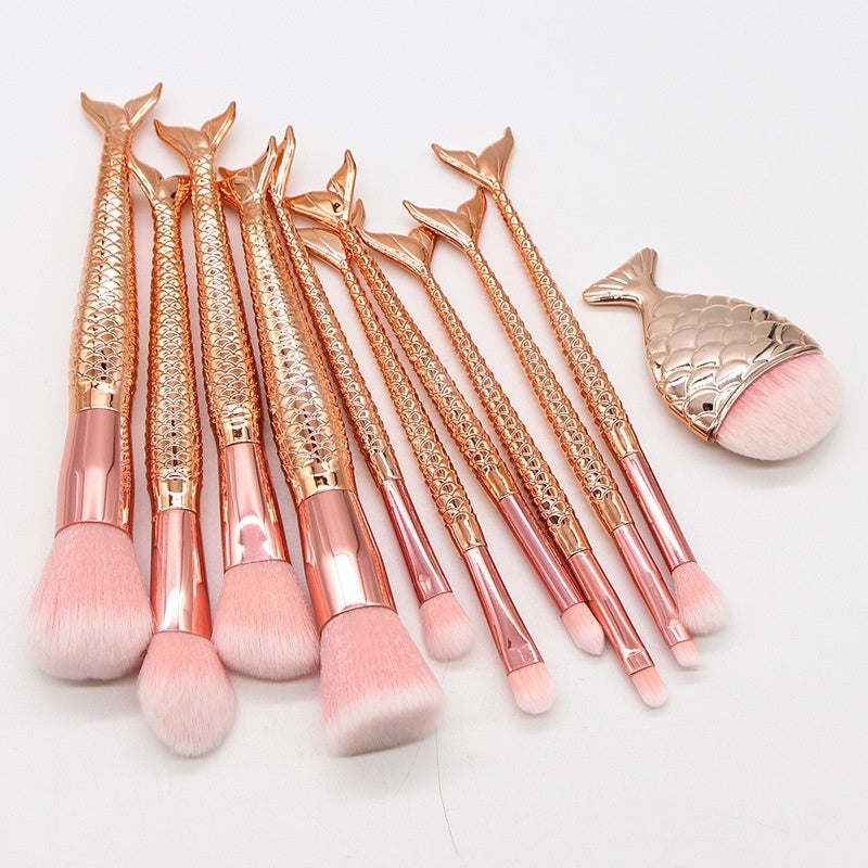 Set of 10 Mermaid-themed makeup brushes from Coremet Ltd in a beauty tools business kit, featuring colorful and soft brush designs.