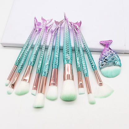 Set of 10 mermaid-themed makeup brushes from Coremet Ltd, featuring colorful handles and soft bristles for beauty application.